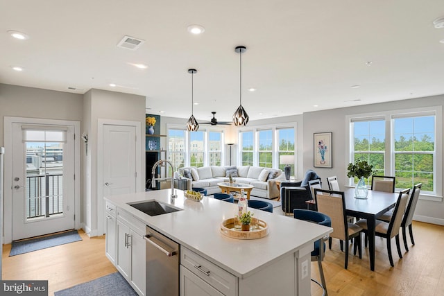 2320 Field Point Rd Unit 4-405, Herndon, VA 20171 - kitchen with a sink, stainless steel dishwasher, light wood-style floors, white cabinets, and recessed lighting