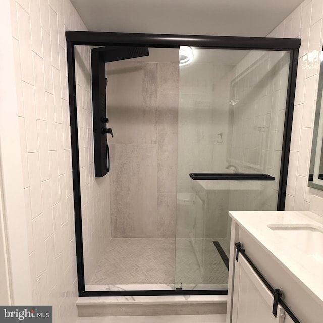 full bath featuring vanity and a stall shower