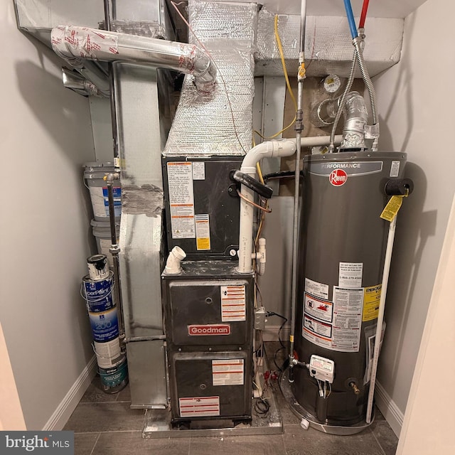 utility room with heating unit and gas water heater