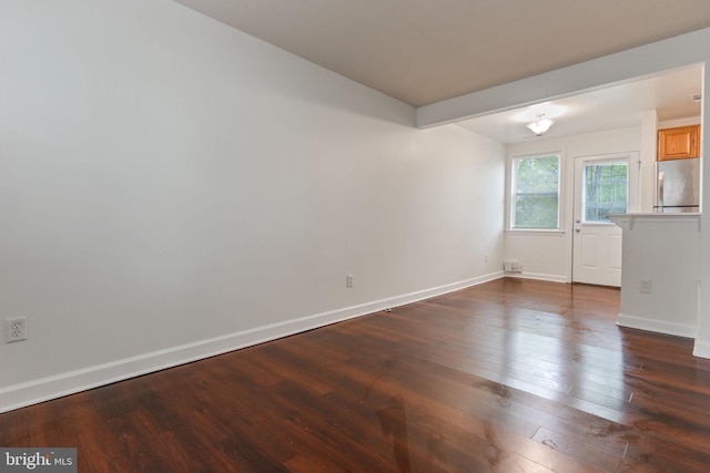 2512 Kent Village Dr, Landover, MD 20785 - empty room featuring dark wood-style flooring and baseboards