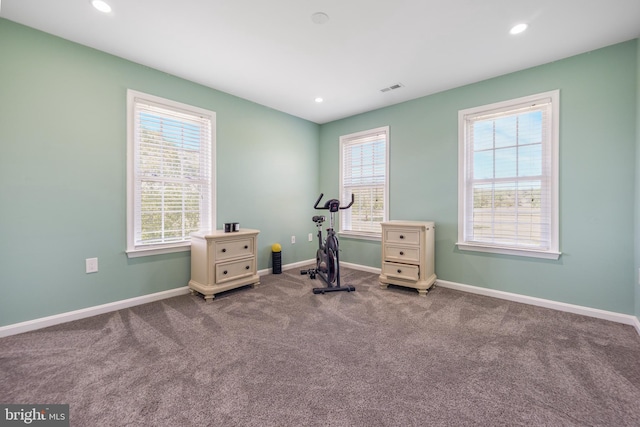 exercise room featuring carpet flooring, baseboards, plenty of natural light, and recessed lighting
