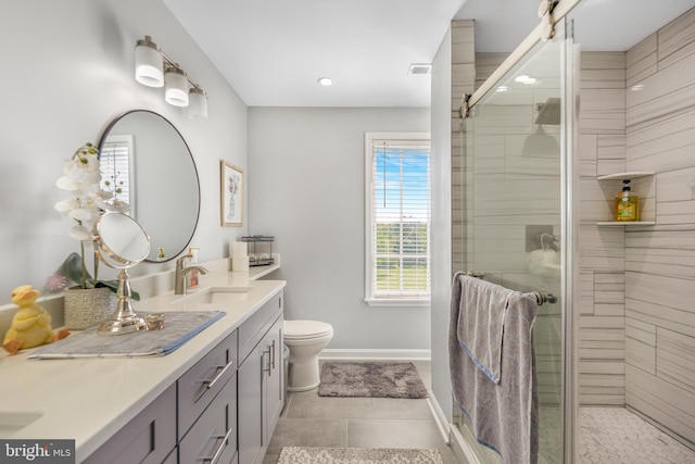 full bath with baseboards, a shower stall, double vanity, recessed lighting, and toilet