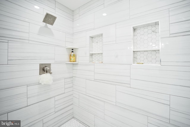 full bathroom with tiled shower