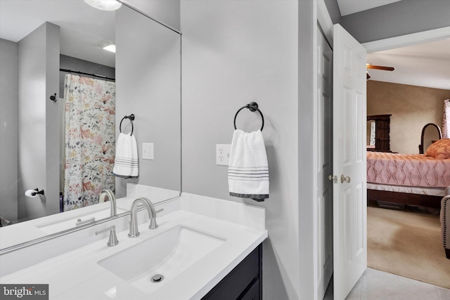 bathroom featuring vanity, connected bathroom, and tile patterned floors