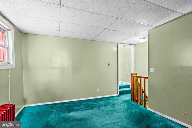 1741 Moore St, Philadelphia, PA 19145 - below grade area featuring radiator, a paneled ceiling, baseboards, and carpet floors