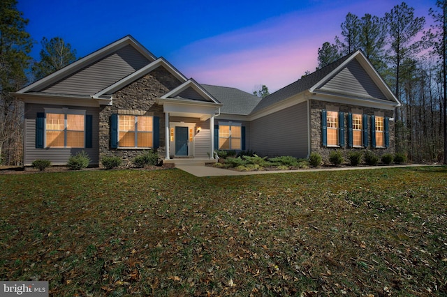 7438 Wildseed Pl, Hughesville, MD 20637 - craftsman-style house with a front yard and stone siding