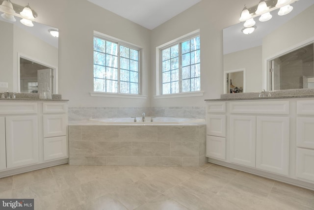 7438 Wildseed Pl, Hughesville, MD 20637 - full bathroom with tile patterned floors, two vanities, a sink, and a bath