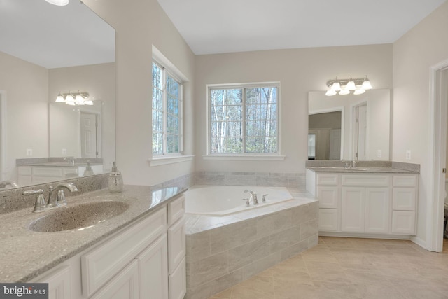 7438 Wildseed Pl, Hughesville, MD 20637 - bathroom featuring tile patterned flooring, a sink, a bath, and two vanities