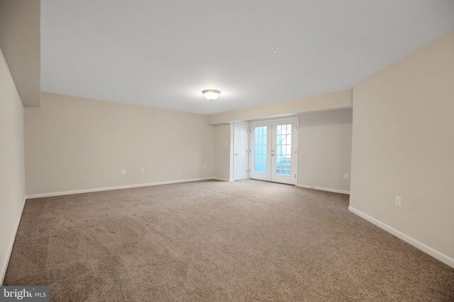 7438 Wildseed Pl, Hughesville, MD 20637 - spare room featuring french doors, baseboards, and carpet floors