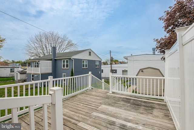 wooden terrace featuring a residential view