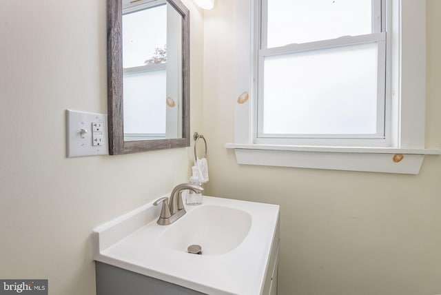 bathroom with a healthy amount of sunlight and vanity