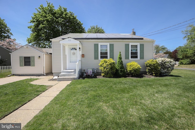 43 Churchill Rd, Cherry Hill, NJ 08034 - bungalow-style home featuring roof mounted solar panels and a front yard