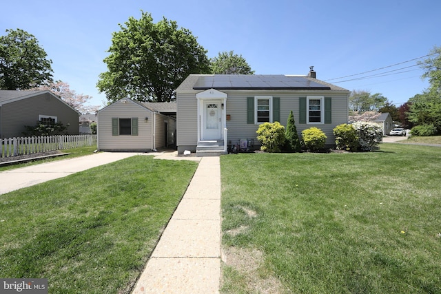 43 Churchill Rd, Cherry Hill, NJ 08034 - bungalow-style home with a chimney, fence, a front yard, and solar panels