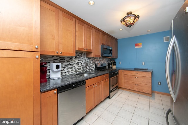 43 Churchill Rd, Cherry Hill, NJ 08034 - kitchen featuring a sink, stainless steel appliances, decorative backsplash, light tile patterned floors, and visible vents