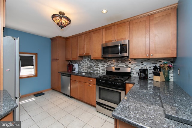 43 Churchill Rd, Cherry Hill, NJ 08034 - kitchen featuring appliances with stainless steel finishes, brown cabinetry, a sink, and tasteful backsplash