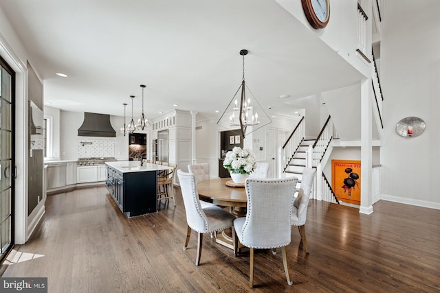 dining space with stairs, baseboards, dark wood-style floors, a notable chandelier, and recessed lighting