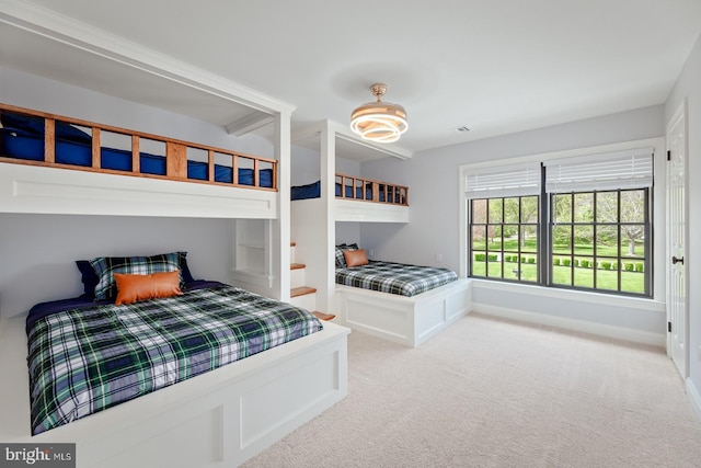 bedroom featuring baseboards and carpet flooring
