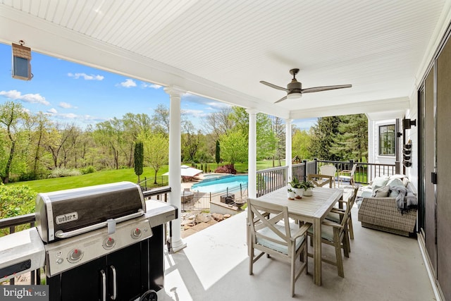 view of patio / terrace featuring a ceiling fan, an outdoor pool, and outdoor dining space