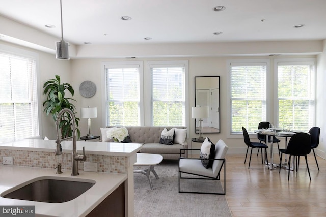 1421 Florida Ave NW Unit 5, Washington, DC 20009 - living area featuring baseboards, light wood-style floors, a healthy amount of sunlight, and recessed lighting
