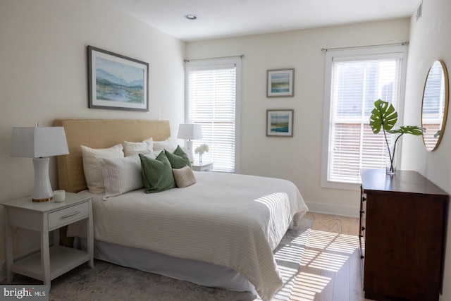 1421 Florida Ave NW Unit 5, Washington, DC 20009 - bedroom with visible vents, baseboards, light wood-style floors, and multiple windows