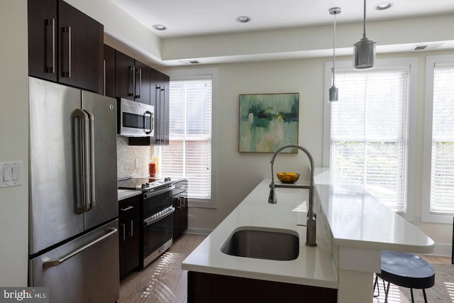 1421 Florida Ave NW Unit 5, Washington, DC 20009 - kitchen with a sink, light countertops, stainless steel appliances, and a healthy amount of sunlight