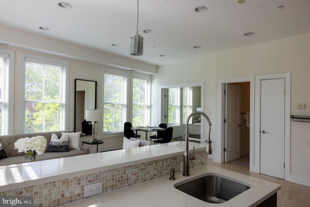 1421 Florida Ave NW Unit 5, Washington, DC 20009 - kitchen with a sink, hanging light fixtures, open floor plan, and light countertops