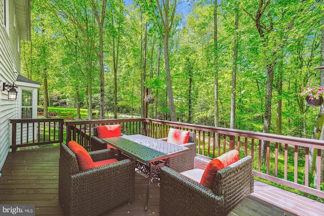 deck featuring outdoor dining area