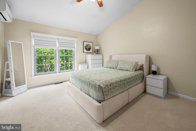 bedroom with a wall unit AC, carpet floors, baseboards, lofted ceiling, and a ceiling fan