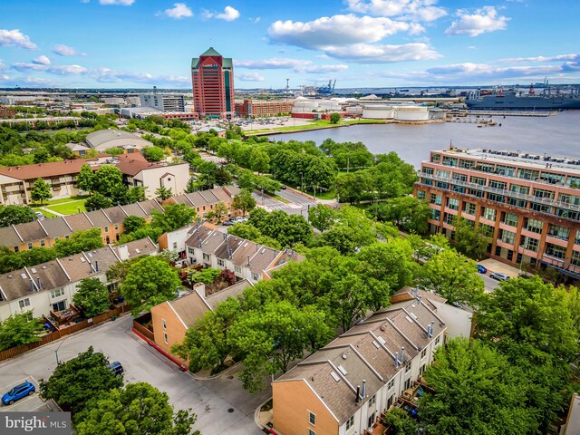 view of urban area featuring a nearby body of water