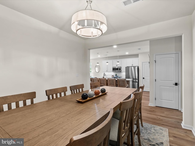 35040 Dundee St Unit 133, Frankford, DE 19945 - dining area with light wood-style floors, visible vents, baseboards, and recessed lighting