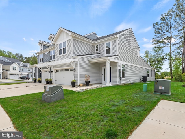 35040 Dundee St Unit 133, Frankford, DE 19945 - view of front of house with a front yard, driveway, and a garage