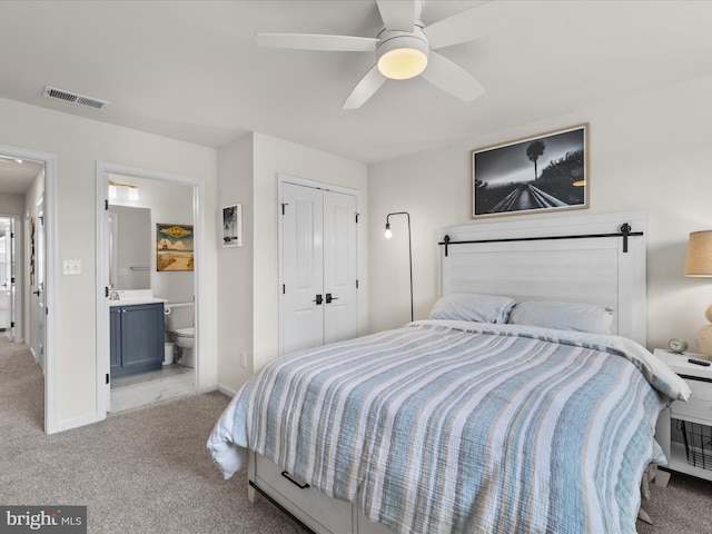 35040 Dundee St Unit 133, Frankford, DE 19945 - bedroom featuring a closet, connected bathroom, visible vents, and carpet floors