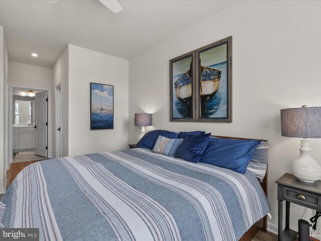 35040 Dundee St Unit 133, Frankford, DE 19945 - bedroom featuring ensuite bath, wood finished floors, and baseboards