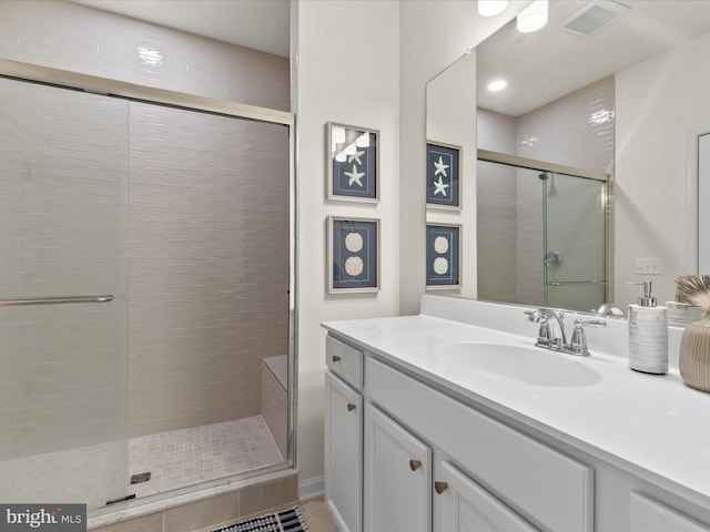 35040 Dundee St Unit 133, Frankford, DE 19945 - full bath featuring tile patterned floors, vanity, visible vents, and a stall shower