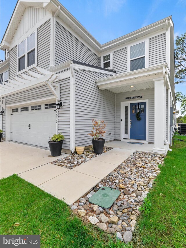 35040 Dundee St Unit 133, Frankford, DE 19945 - traditional-style house with an attached garage, driveway, and cooling unit