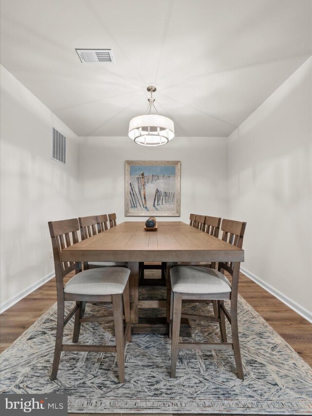 35040 Dundee St Unit 133, Frankford, DE 19945 - dining room featuring baseboards, visible vents, and wood finished floors
