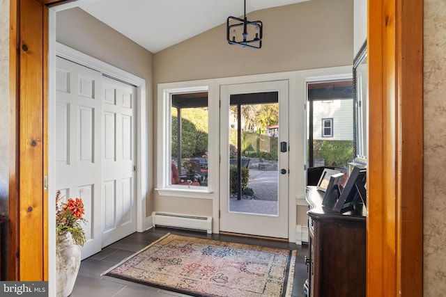 doorway to outside with an inviting chandelier, a baseboard radiator, and vaulted ceiling
