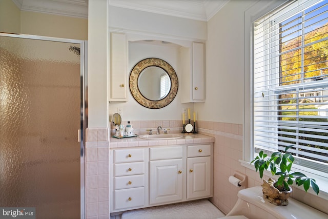 bathroom with a healthy amount of sunlight, tile walls, and a shower stall