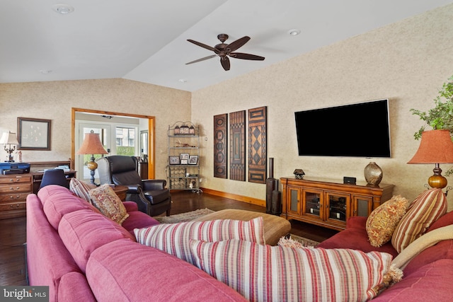 living room featuring a ceiling fan, baseboards, vaulted ceiling, and wood finished floors