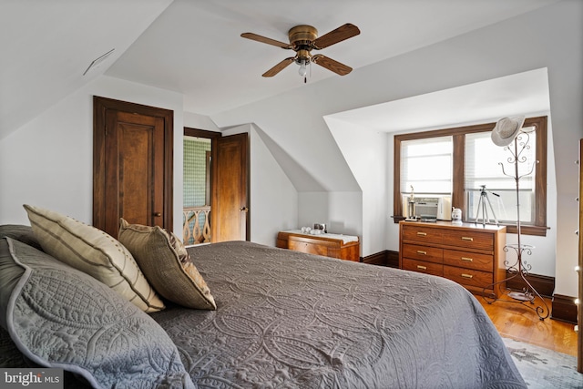 bedroom featuring ceiling fan, cooling unit, and lofted ceiling