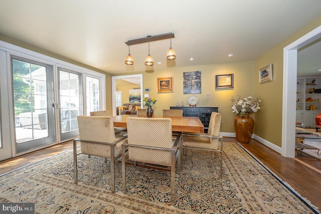 dining room featuring baseboards and wood finished floors