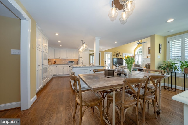 dining room featuring recessed lighting, baseboards, dark wood-type flooring, and ceiling fan with notable chandelier