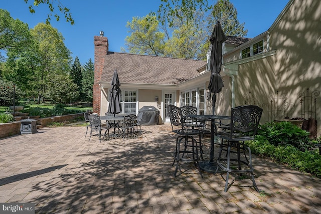 view of patio / terrace featuring outdoor dining space and a grill