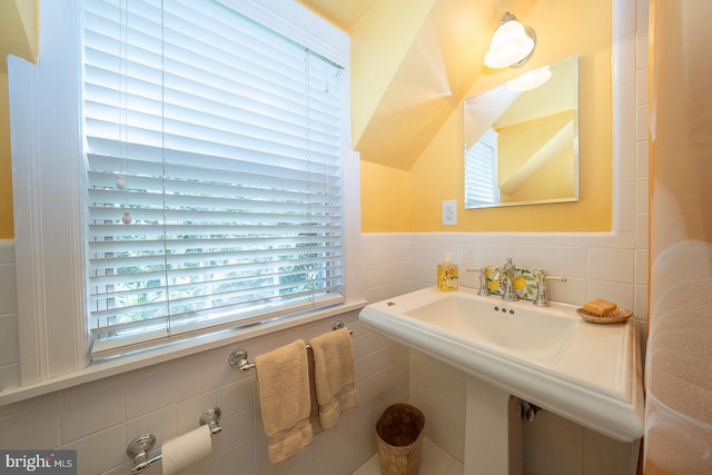 bathroom featuring tile walls and a wainscoted wall