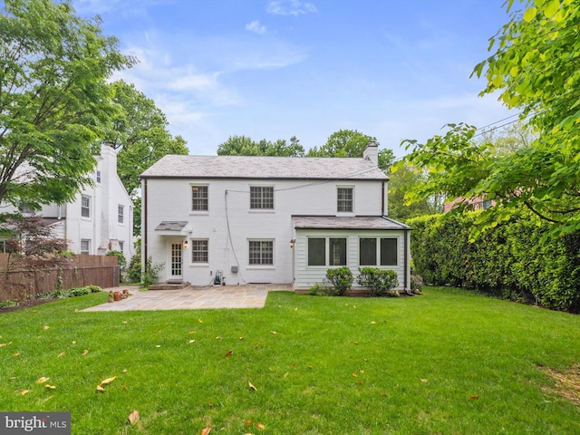 5513 Park St, Chevy Chase, MD 20815 - rear view of house with a chimney and a patio