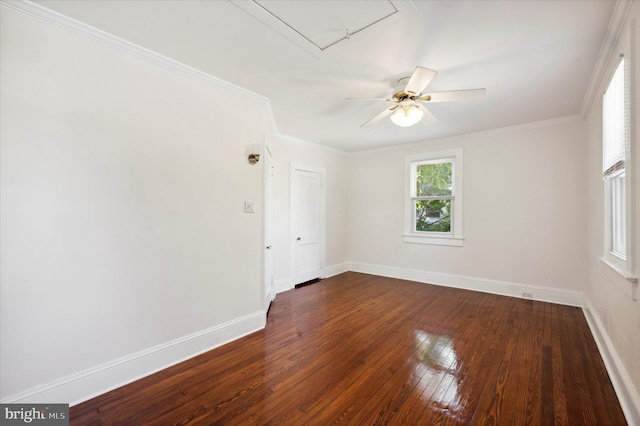 empty room featuring baseboards, ornamental molding, ceiling fan, and hardwood / wood-style flooring