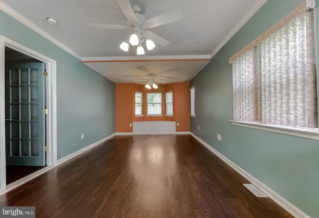 unfurnished room featuring crown molding, a ceiling fan, baseboards, and wood finished floors
