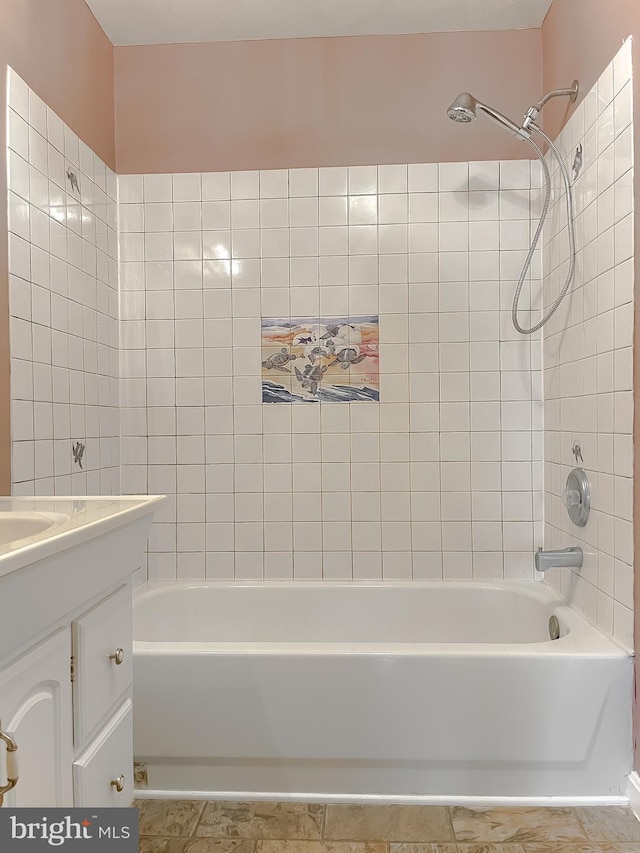 full bathroom with tile patterned floors, washtub / shower combination, and vanity