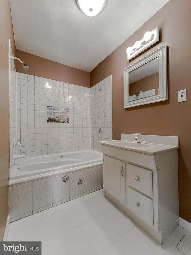 bathroom featuring vanity, tile patterned floors, and tiled shower / bath