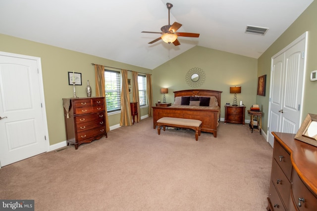 bedroom with vaulted ceiling, light colored carpet, baseboards, and ceiling fan